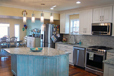 Example of a mid-sized classic l-shaped medium tone wood floor eat-in kitchen design in Baltimore with an undermount sink, raised-panel cabinets, white cabinets, quartz countertops, gray backsplash, matchstick tile backsplash, stainless steel appliances and an island
