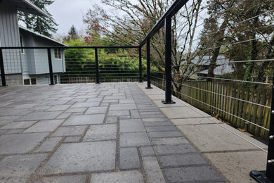 Example of a mid-sized 1960s home design design in Portland