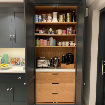 Modern monochrome handmade kitchen with full length larder