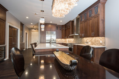 Example of a transitional medium tone wood floor and brown floor kitchen/dining room combo design in Other with gray walls