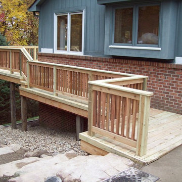 LARGE BASIC PRESSURE TREATED DECK WITH CEDAR INFILL AND BALUSTERS