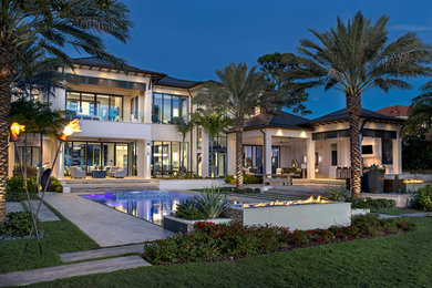 Trendy beige two-story stucco house exterior photo in Orlando
