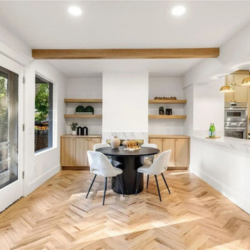 Warm wood tones. Herringbone perfection. 12 foot island. Custom cabinets and bui