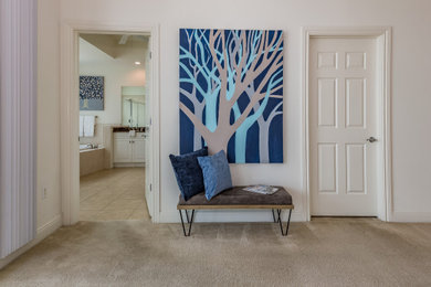 Large minimalist master carpeted and beige floor bedroom photo in Tampa with white walls