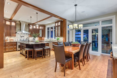 Example of a large classic marble floor and brown floor great room design in Vancouver with gray walls and no fireplace