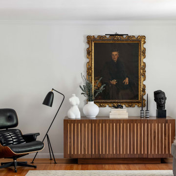 Modern Classic Living Room With Iconic Lounge Chair & Portrait Art