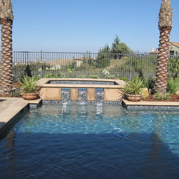 Raised spa with custom glass tile