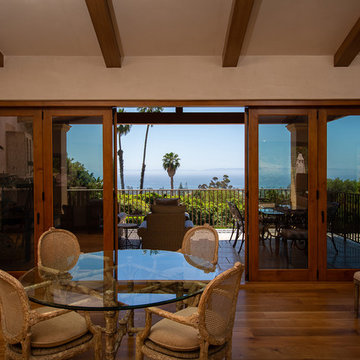 Folding Door Systems Create Open-Air Dining in a Spanish Style Home