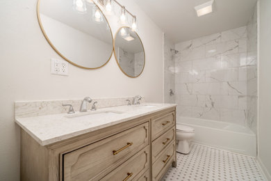 Example of a mid-sized bathroom design in Little Rock with a freestanding vanity