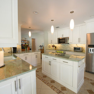 Photo of a modern kitchen pantry in Miami with a single-bowl sink, raised-panel cabinets, white cabinets, quartzite benchtops, glass tile splashback, stainless steel appliances, porcelain floors, with island and green benchtop.