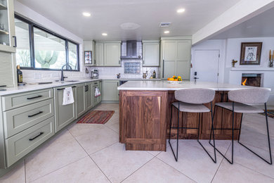 Large transitional porcelain tile and beige floor kitchen photo in Phoenix with shaker cabinets, ceramic backsplash and an island