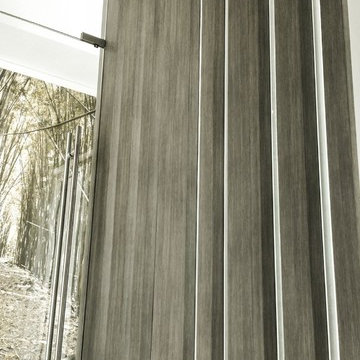 Brickell private condo - Custom columns wrapped with wood architectural film.