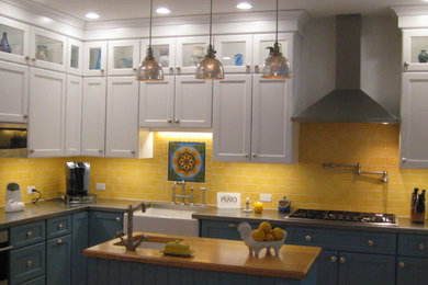 Cottage l-shaped enclosed kitchen photo in Chicago with a farmhouse sink, shaker cabinets, white cabinets, wood countertops, yellow backsplash, subway tile backsplash, stainless steel appliances and an island
