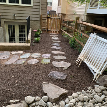 The walkway continues to the fence entrance