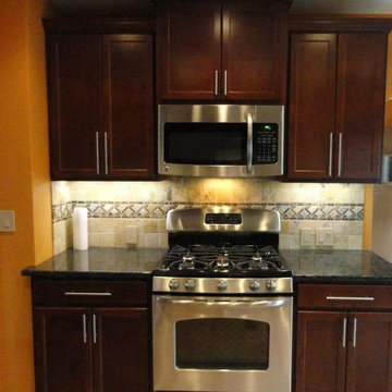 Kitchen ft. Staggered Cabient & Stone Backsplash