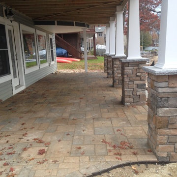 Lakeside patio with stone column bases