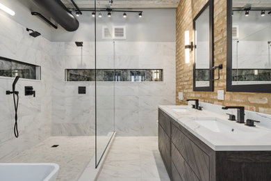 Bathroom - large industrial master gray tile and porcelain tile porcelain tile, gray floor, double-sink, exposed beam and brick wall bathroom idea in Chicago with furniture-like cabinets, black cabinets, a wall-mount toilet, brown walls, an undermount sink, quartzite countertops, white countertops, a niche and a freestanding vanity