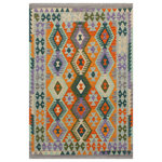 Bareens Designer Rugs - Southwestern Turkish Kilim Silvana Hand-Woven Wool Rug - 4'0'' x 5'5'' - Elevate the elegance of your home with this stunning hand-woven tribal Kilim wool rug. Meticulously crafted on a loom by the Nomad Turkman people using hand-spun wool and 100% natural vegetable dyes, these rugs are recognized for their repetitive geometric patterns, incorporating naturalistic floral and traditional designs. The contemporary fashion palette results in bold, sharp patterns that are incredibly versatile, as the pattern is the same on both sides. These reversible rugs feature a lighter shade on one side and brighter colors on the other, providing versatility according to preference. These unique rugs are made by knotting short strands of different colors onto the warps and securing them by tightly pressing the wefts. The designs are created by interweaving the various colored wefts and warps. Kilims are known for their exceptional durability and versatility, making them truly unique rugs.  Product Details    Rug Size: 4'0'' x 5'5''  Material: 100% Wool  Style: Kilim, Flat Weave, Dhurrie, Turkish, Southwestern, Rustic, Tribal  Colors: Rust, Blue  Weave Type: Hand-Woven, Handmade  Pile Height: Less than 0.25 inch