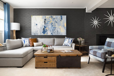 Large minimalist carpeted and beige floor living room photo in DC Metro with a brick fireplace, a standard fireplace and gray walls