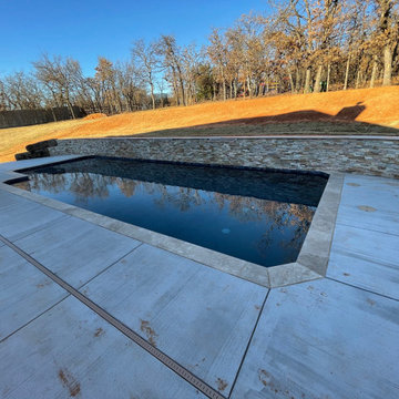 Custom pool with elevated back wall and LED Waterfalls