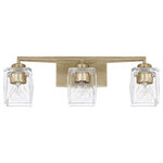 Capital Lighting - Karina 3 Light Vanity, Winter Gold - The Karina 3-light vanity adds statement-making style at the bath vanity. Clear  faceted glass shades set against a stunning Winter Gold finish add drama to the settings by scattering light in multiple directions. Angled beams and the prismatic glass elements speak to the architectural inspiration of this bath vanity fixture.&nbsp