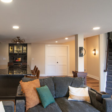 Traditional Style Basement Remodel, Accented by New Bar Area With Warmer Tones