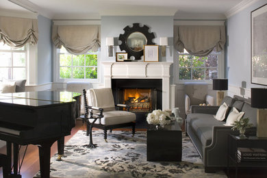Inspiration for a beach style living room in Los Angeles with blue walls and a standard fireplace.
