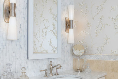Inspiration for a timeless master beige tile and porcelain tile beige floor bathroom remodel in New York with furniture-like cabinets, white cabinets, blue walls, an undermount sink, marble countertops, a hinged shower door and gray countertops