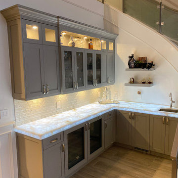 Custom handcrafted wet bar, gray finish light up stone counter top & glass doors
