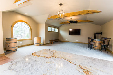 Example of a large mountain style open concept carpeted and gray floor living room design in Providence with a bar, brown walls, a corner fireplace and a wall-mounted tv