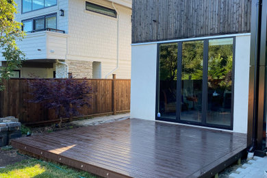 Example of a small trendy backyard deck design in Vancouver