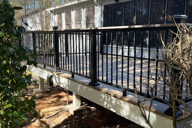 Inspiration for a mid-sized contemporary backyard ground level metal railing deck remodel in Atlanta