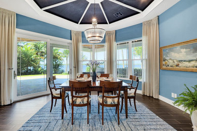 Inspiration for a large coastal brown floor kitchen/dining room combo remodel in Other with blue walls