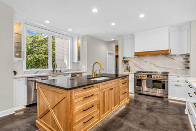 Inspiration for a large cottage u-shaped concrete floor and gray floor eat-in kitchen remodel in Indianapolis with an undermount sink, shaker cabinets, white cabinets, quartzite countertops, white backsplash, quartz backsplash, paneled appliances, two islands and black countertops