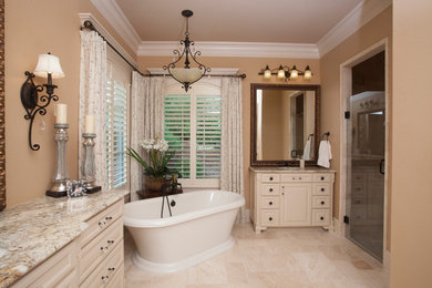 Inspiration for a mid-sized timeless master multicolored tile and stone tile marble floor bathroom remodel in New Orleans with furniture-like cabinets, white cabinets and granite countertops