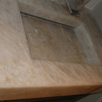 Cristallo quartzite vanity top with integrated mitred sink