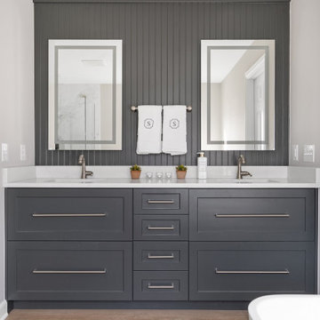 White Primary En Suite with Black Cabinets & Beadboard