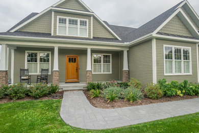 Home design - large craftsman home design idea in Burlington