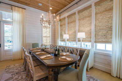 This is an example of a beach style dining room in Miami.