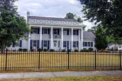 Example of a large classic white two-story exterior home design in Other with a shingle roof