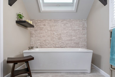 Transitional master gray tile and stone tile ceramic tile and gray floor bathroom photo in Philadelphia with brown cabinets, a two-piece toilet, gray walls, an undermount sink, quartzite countertops, a hinged shower door, gray countertops and recessed-panel cabinets