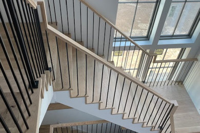 Staircase - large modern wooden l-shaped mixed material railing staircase idea in New York with wooden risers