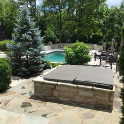 Aspen Spa sunk into a pit to give inground appearance - Hot Tubs