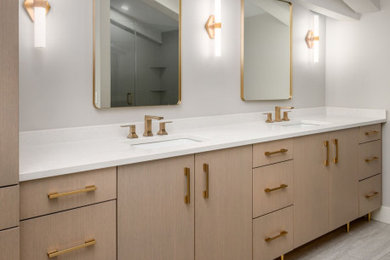Master double-sink bathroom photo in Chicago with light wood cabinets, white walls and white countertops