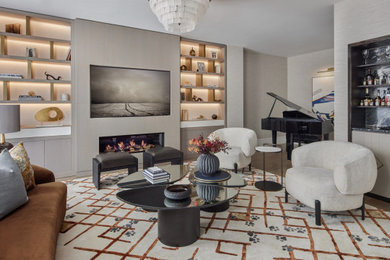Photo of a medium sized contemporary living room in London with wallpapered walls, a music area, grey walls, dark hardwood flooring, a ribbon fireplace, a wall mounted tv and brown floors.