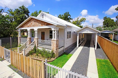 Mid-sized arts and crafts white one-story concrete fiberboard gable roof photo in Houston