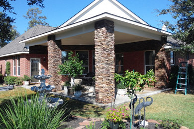 Patio kitchen - mid-sized craftsman backyard concrete patio kitchen idea in Houston with a roof extension