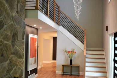 Example of a small trendy l-shaped wood railing staircase design in Houston