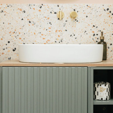 Pink & green bathroom with mix of tiles & patterns