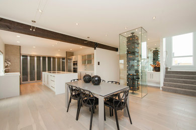 Mid-sized trendy light wood floor kitchen/dining room combo photo in Other with white walls and no fireplace